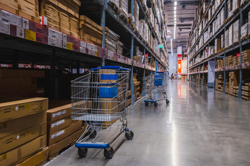 2 cart in warehouse aisle in an IKEA store - obrazy, fototapety, plakaty