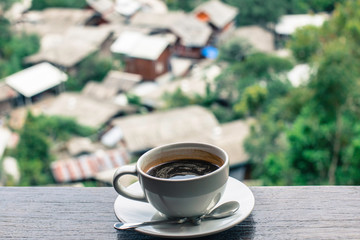 cup of coffee on wooden table