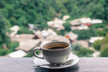 cup of coffee on wooden table