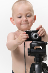 Child using a camera on white background