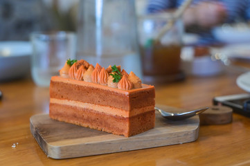 Homemade Thai tea cake on wooden plate