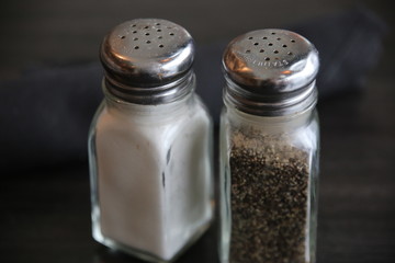 A set of salt and pepper shakers on the table