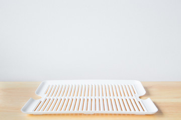 Empty Plastic plate on wooden floor. background for kitchen food or design display montage product.