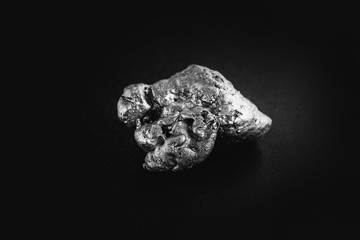 natural platinum nugget isolated on black background