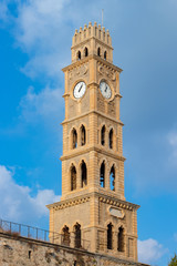 Fototapeta na wymiar old clock tower in the old city of Acre, Israel
