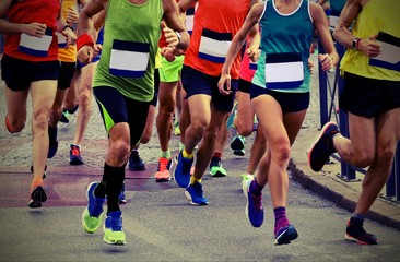 athletes runninng on the road with old toned effect
