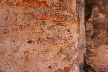 Old weathered red brick columns