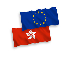 National vector fabric wave flags of European Union and Hong Kong isolated on white background. 1 to 2 proportion.