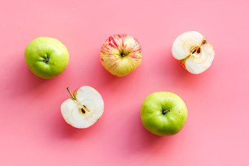 Autumn composition with fresh apples on pink background top view pattern