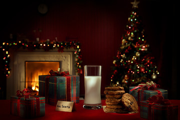 close up view of glass of milk with cookies on color back
