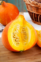 Sliced pumpkins on a wooden table.