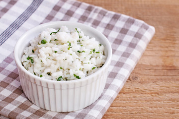 Bowl with boiled rice and vegetables.