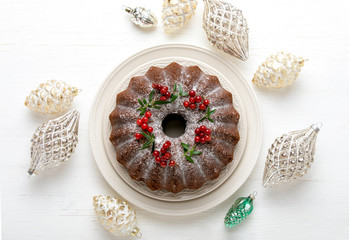 Christmas bundt cake with Xmas holiday decorations, top down view