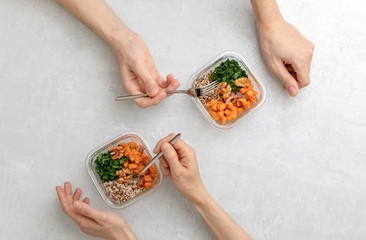 Home prepared healthy eating concept,  top down view on office kitchen table with healthy food in lunch boxes
