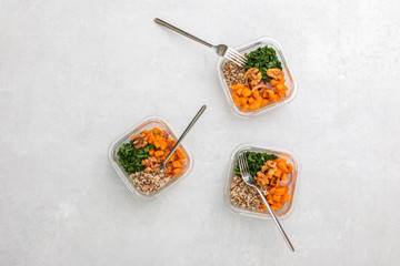 Home prepared healthy eating concept,  top down view on office kitchen table with healthy food in lunch boxes