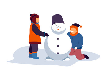 Boys building snowman with bucket on top