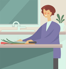 Woman cooking and cutting vegetables with knife in kitchen