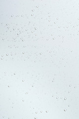 Water drops on white surface background.