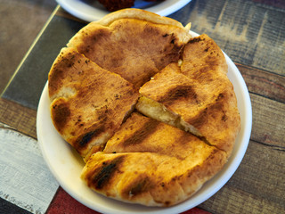 Pita bread roasted with garlic on a plate