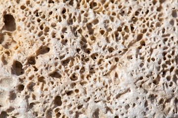 Stony beach by the sea, background of small stones, close up