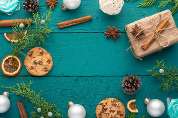 Christmas or New Year. Christmas presents on a dark green tree. Toys and coniferous branches. Christmas mood and warmth