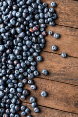 Fresh blueberries on wooden table. Top view