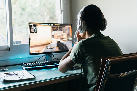 Teenager playing Counter Strike video game