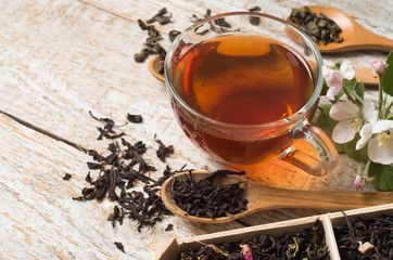 various types of tea on a wooden background