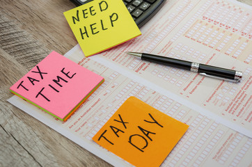 Australian tax form, calculator and pen. Business concept.