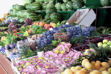 Stall with different fresh fruits and nuts outdoors