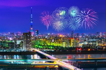 Fototapeta na wymiar Fireworks over Tokyo cityscape at night, Japan