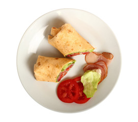 Wrap tortilla sandwich with ham, tomato, lettuce.