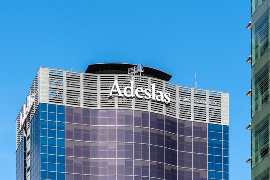Adeslas Health Services company Skyscraper in Financial District of Madrid against sky