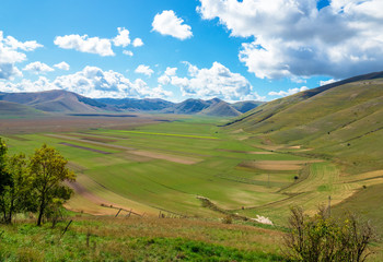Castelluccio di Norcia, 2019 (Umbria, Italy) - The famous landscape highland of Sibillini Mountains, during the autumn, with the small stone village destroyed by a recent earthquake