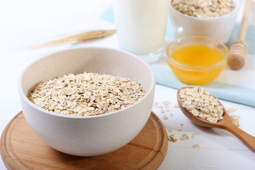Raw oatmeal long cooking on the table.