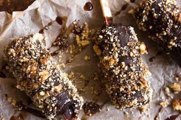 choc-ice on a stick isolated on a rustic background.