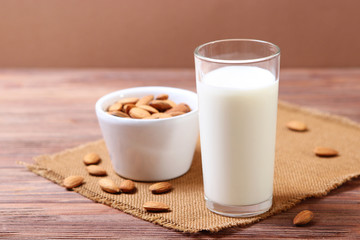 Almond milk and almonds on the table. Vegetable milk. Vegetarian milk.