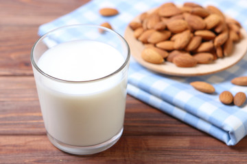 Almond milk and almonds on the table. Vegetable milk. Vegetarian milk.
