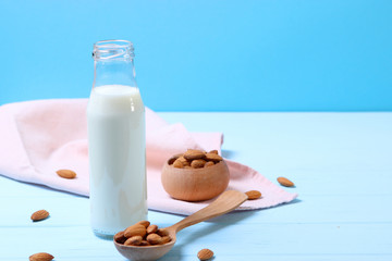 Almond milk and almonds on the table. Vegetable milk. Vegetarian milk.