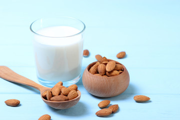 Almond milk and almonds on the table. Vegetable milk. Vegetarian milk.