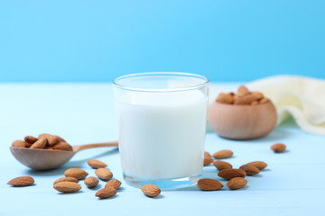 Almond milk and almonds on the table. Vegetable milk. Vegetarian milk.