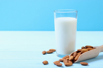 Almond milk and almonds on the table. Vegetable milk. Vegetarian milk.