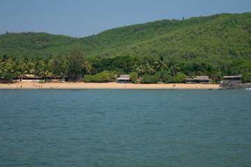 Sea and green mountain landscape of Om beach in Gokarna, India