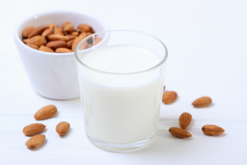 Almond milk and almonds on the table. Vegetable milk. Vegetarian milk.