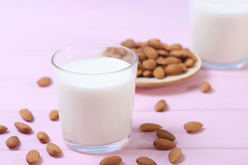 Almond milk and almonds on the table. Vegetable milk. Vegetarian milk.