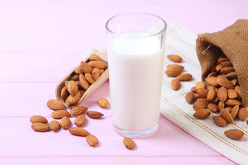 Almond milk and almonds on the table. Vegetable milk. Vegetarian milk.