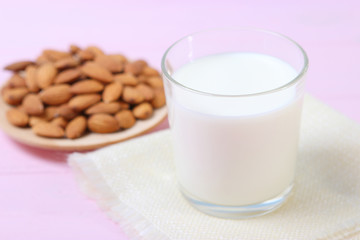 Almond milk and almonds on the table. Vegetable milk. Vegetarian milk.