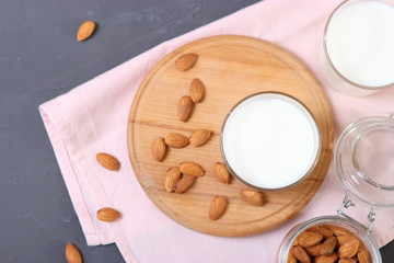 Almond milk and almonds on the table. Vegetable milk. Vegetarian milk.