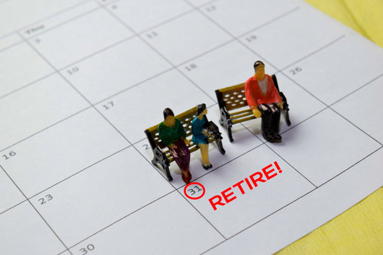 Miniature People Thingking About Planning For Retirement Target Or Quit They Job. Isolated Calendar Background