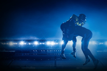 Fototapeta na wymiar American football players on stadium in action